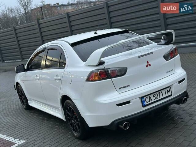 Білий Міцубісі Lancer, об'ємом двигуна 2 л та пробігом 225 тис. км за 7800 $, фото 4 на Automoto.ua