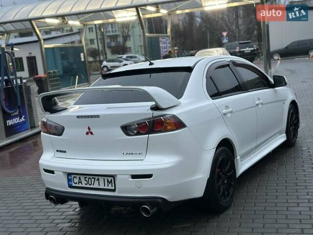 Білий Міцубісі Lancer, об'ємом двигуна 2 л та пробігом 225 тис. км за 7800 $, фото 3 на Automoto.ua