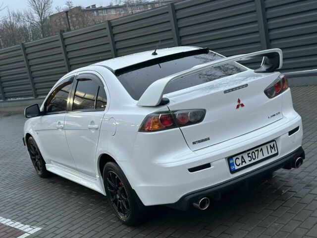 Белый Мицубиси Лансер, объемом двигателя 2 л и пробегом 225 тыс. км за 7800 $, фото 7 на Automoto.ua