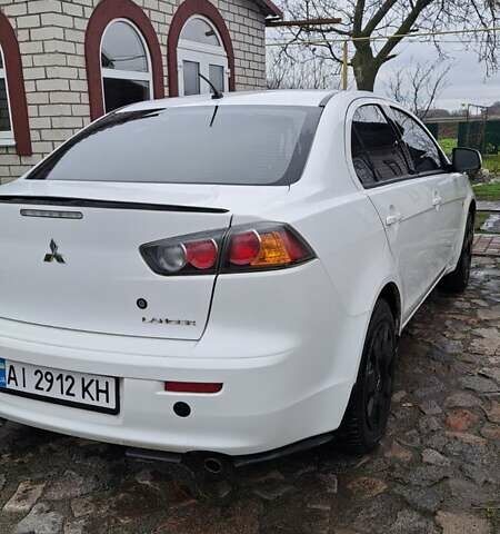 Белый Мицубиси Лансер, объемом двигателя 1.5 л и пробегом 160 тыс. км за 7600 $, фото 5 на Automoto.ua