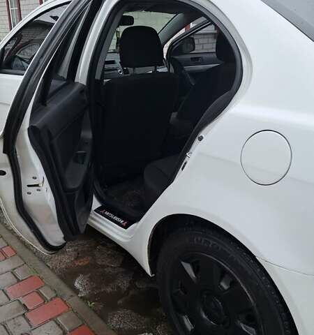 Белый Мицубиси Лансер, объемом двигателя 1.5 л и пробегом 160 тыс. км за 7600 $, фото 14 на Automoto.ua