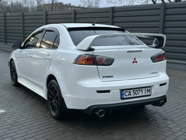 Белый Мицубиси Лансер, объемом двигателя 2 л и пробегом 225 тыс. км за 7800 $, фото 6 на Automoto.ua