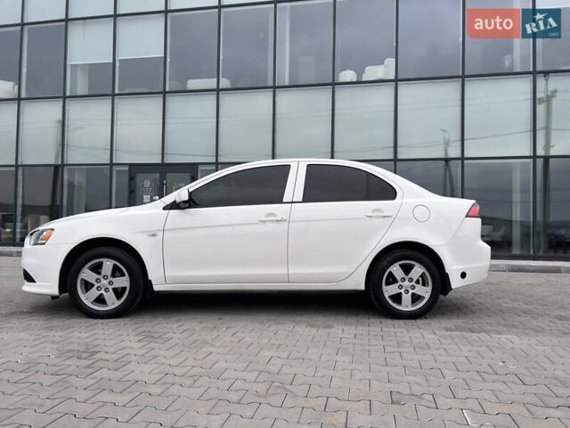 Белый Мицубиси Лансер, объемом двигателя 1.59 л и пробегом 145 тыс. км за 7500 $, фото 4 на Automoto.ua