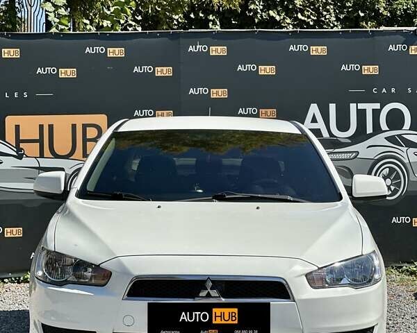 Белый Мицубиси Лансер, объемом двигателя 2 л и пробегом 124 тыс. км за 7700 $, фото 1 на Automoto.ua