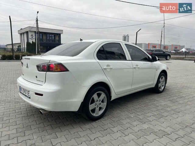 Белый Мицубиси Лансер, объемом двигателя 1.59 л и пробегом 145 тыс. км за 7500 $, фото 1 на Automoto.ua