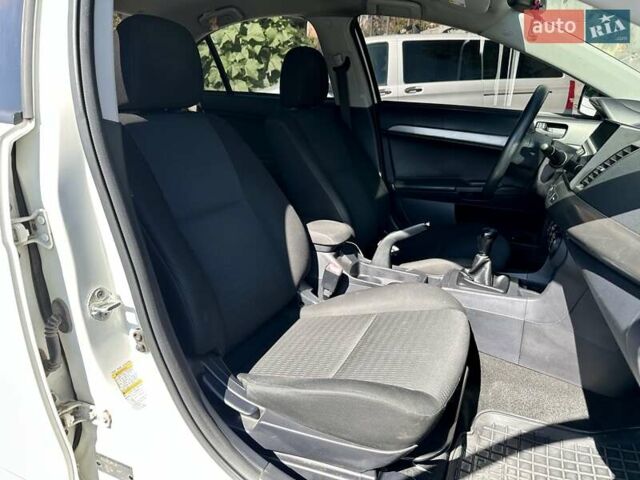 Белый Мицубиси Лансер, объемом двигателя 2 л и пробегом 124 тыс. км за 7700 $, фото 9 на Automoto.ua