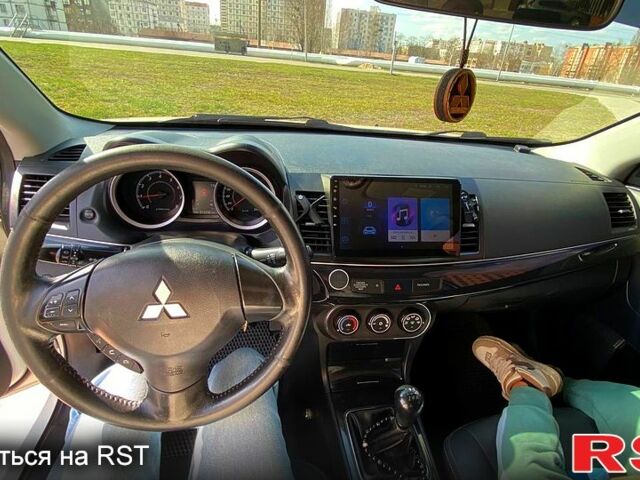 Белый Мицубиси Лансер, объемом двигателя 16 л и пробегом 214 тыс. км за 7400 $, фото 4 на Automoto.ua