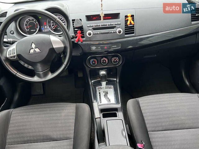 Белый Мицубиси Лансер, объемом двигателя 1.59 л и пробегом 145 тыс. км за 7500 $, фото 20 на Automoto.ua