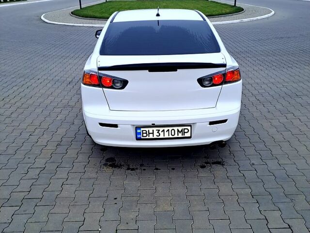 Белый Мицубиси Лансер, объемом двигателя 2 л и пробегом 188 тыс. км за 7700 $, фото 1 на Automoto.ua