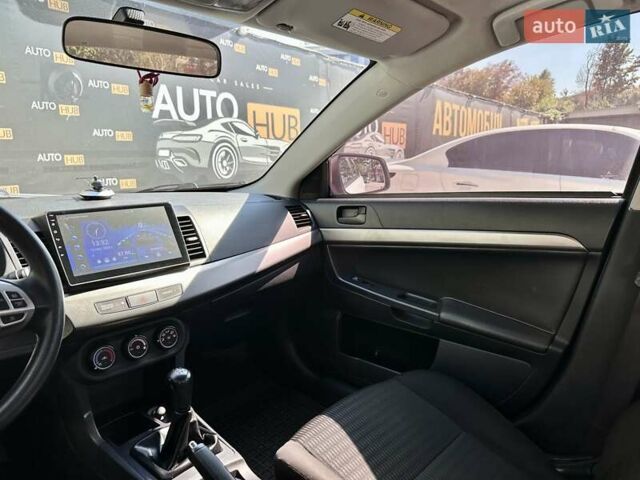 Белый Мицубиси Лансер, объемом двигателя 2 л и пробегом 124 тыс. км за 7700 $, фото 12 на Automoto.ua