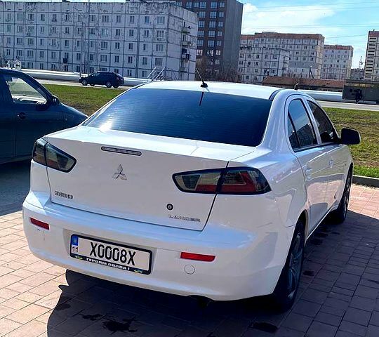 Белый Мицубиси Лансер, объемом двигателя 16 л и пробегом 214 тыс. км за 7400 $, фото 1 на Automoto.ua