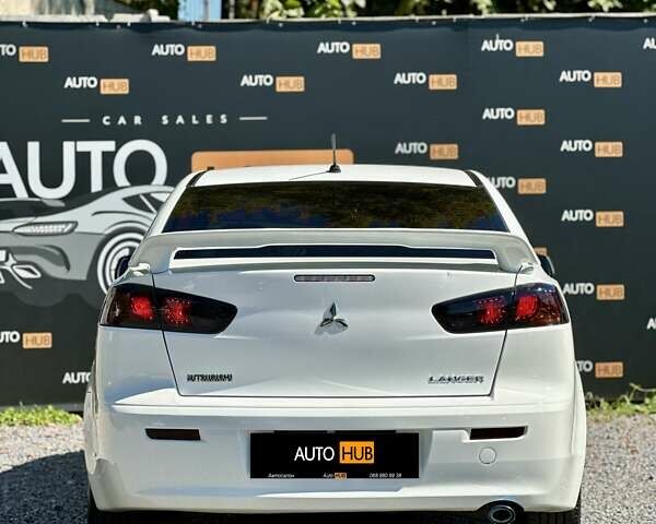 Белый Мицубиси Лансер, объемом двигателя 2 л и пробегом 124 тыс. км за 7700 $, фото 4 на Automoto.ua