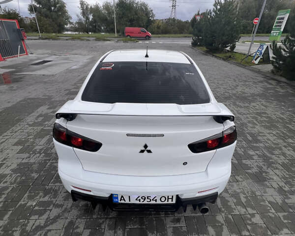 Білий Міцубісі Lancer, об'ємом двигуна 1.6 л та пробігом 231 тис. км за 6900 $, фото 11 на Automoto.ua