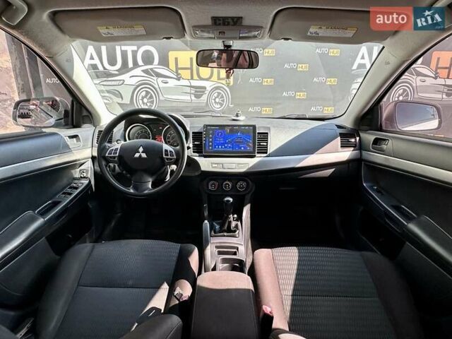 Белый Мицубиси Лансер, объемом двигателя 2 л и пробегом 124 тыс. км за 7700 $, фото 11 на Automoto.ua