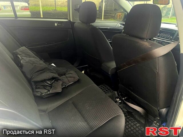 Білий Міцубісі Lancer, об'ємом двигуна 1.6 л та пробігом 162 тис. км за 6500 $, фото 8 на Automoto.ua