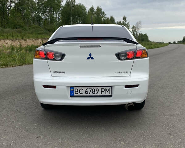 Білий Міцубісі Lancer, об'ємом двигуна 2 л та пробігом 208 тис. км за 8700 $, фото 13 на Automoto.ua