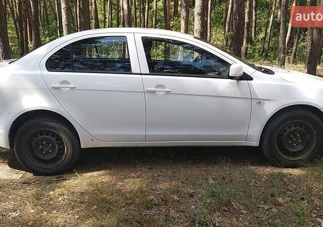Білий Міцубісі Lancer, об'ємом двигуна 1.6 л та пробігом 155 тис. км за 9000 $, фото 14 на Automoto.ua