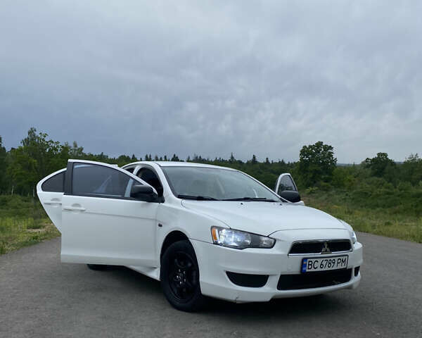 Білий Міцубісі Lancer, об'ємом двигуна 2 л та пробігом 208 тис. км за 8700 $, фото 10 на Automoto.ua