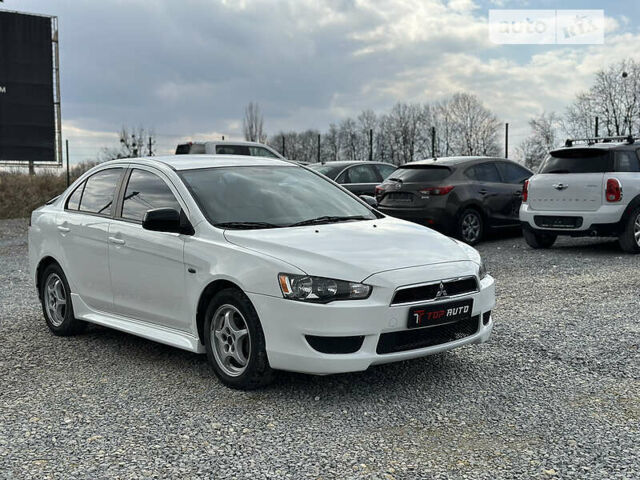 Білий Міцубісі Lancer, об'ємом двигуна 2 л та пробігом 194 тис. км за 7650 $, фото 16 на Automoto.ua