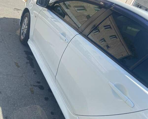 Белый Мицубиси Лансер, объемом двигателя 1.6 л и пробегом 238 тыс. км за 8500 $, фото 1 на Automoto.ua