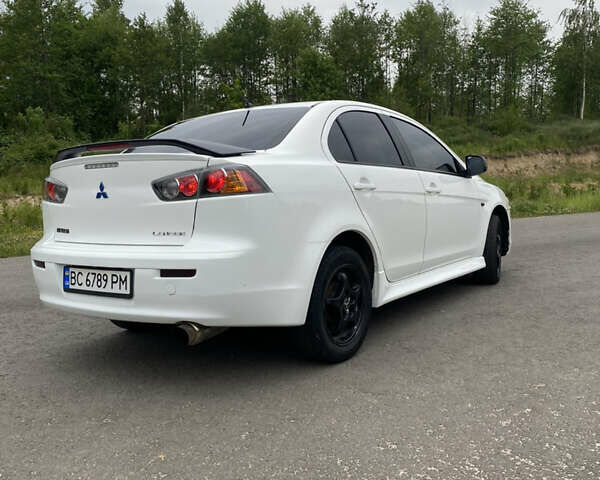 Білий Міцубісі Lancer, об'ємом двигуна 2 л та пробігом 208 тис. км за 8700 $, фото 14 на Automoto.ua