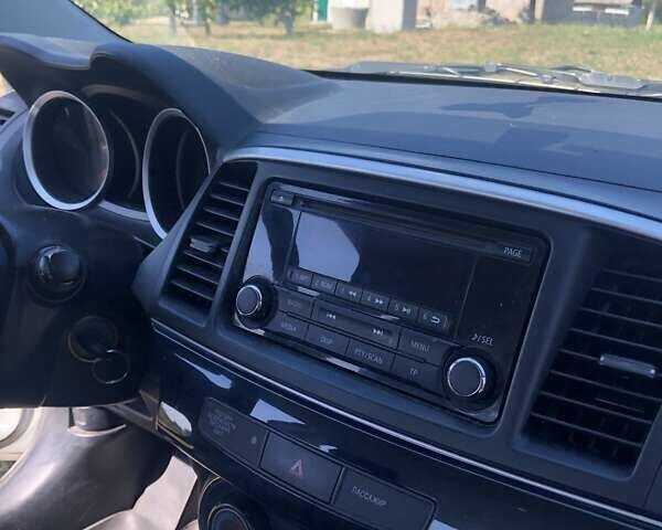 Белый Мицубиси Лансер, объемом двигателя 1.6 л и пробегом 100 тыс. км за 9650 $, фото 2 на Automoto.ua