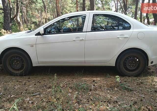 Білий Міцубісі Lancer, об'ємом двигуна 1.6 л та пробігом 155 тис. км за 9000 $, фото 13 на Automoto.ua