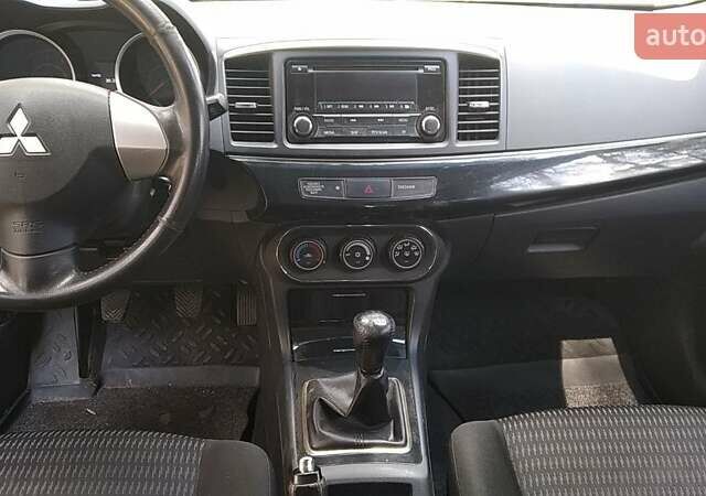 Білий Міцубісі Lancer, об'ємом двигуна 1.6 л та пробігом 155 тис. км за 9000 $, фото 9 на Automoto.ua