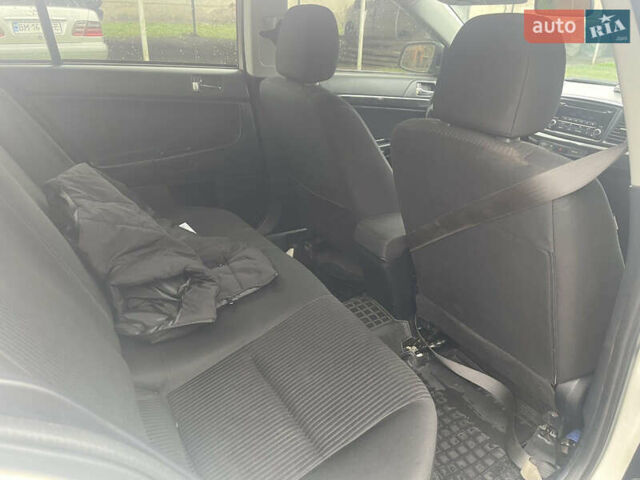 Белый Мицубиси Лансер, объемом двигателя 1.59 л и пробегом 163 тыс. км за 6700 $, фото 1 на Automoto.ua