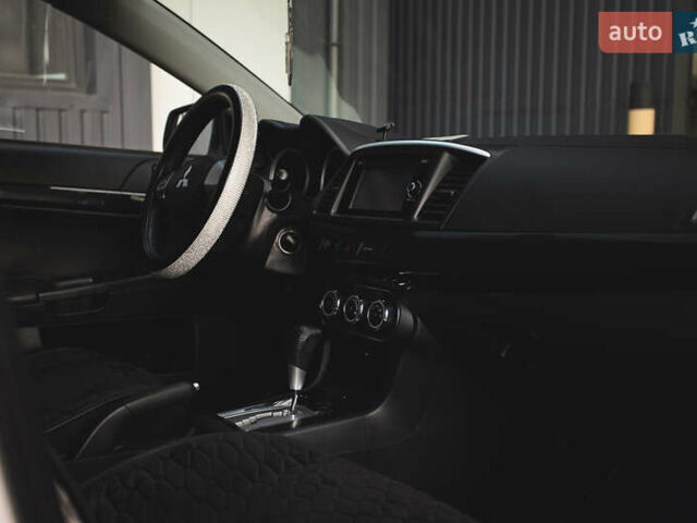 Білий Міцубісі Lancer, об'ємом двигуна 1.6 л та пробігом 248 тис. км за 8500 $, фото 18 на Automoto.ua