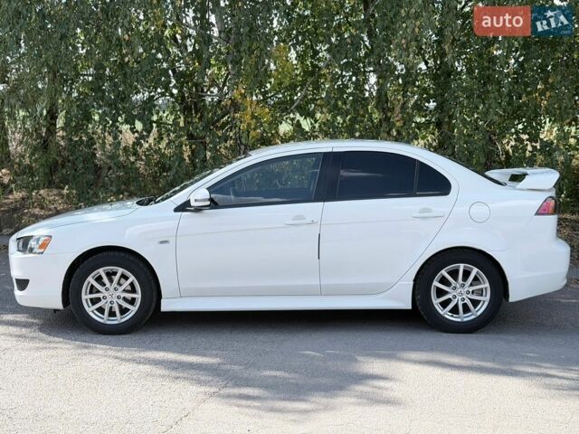 Білий Міцубісі Lancer, об'ємом двигуна 2 л та пробігом 135 тис. км за 8400 $, фото 15 на Automoto.ua