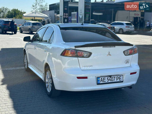Білий Міцубісі Lancer, об'ємом двигуна 2 л та пробігом 165 тис. км за 7899 $, фото 4 на Automoto.ua