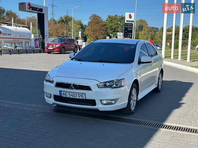 Білий Міцубісі Lancer, об'ємом двигуна 2 л та пробігом 165 тис. км за 7899 $, фото 2 на Automoto.ua