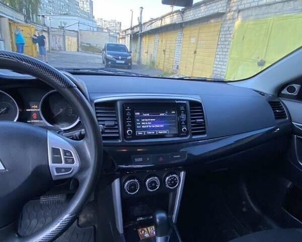 Белый Мицубиси Лансер, объемом двигателя 2 л и пробегом 114 тыс. км за 10000 $, фото 14 на Automoto.ua