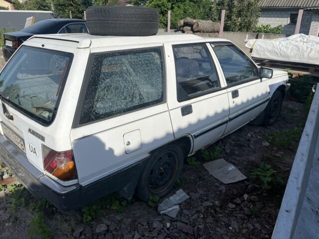 Белый Мицубиси Лансер, объемом двигателя 1.9 л и пробегом 438 тыс. км за 463 $, фото 1 на Automoto.ua