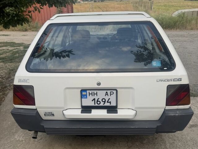 Білий Міцубісі Lancer, об'ємом двигуна 1.5 л та пробігом 275 тис. км за 1951 $, фото 4 на Automoto.ua