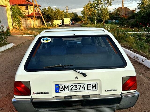 Белый Мицубиси Лансер, объемом двигателя 1.5 л и пробегом 55 тыс. км за 1500 $, фото 12 на Automoto.ua