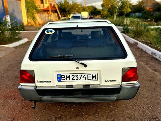 Белый Мицубиси Лансер, объемом двигателя 1.5 л и пробегом 55 тыс. км за 1500 $, фото 5 на Automoto.ua