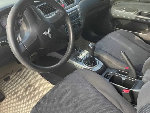 Білий Міцубісі Lancer, об'ємом двигуна 1.6 л та пробігом 279 тис. км за 3900 $, фото 5 на Automoto.ua