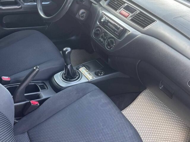 Білий Міцубісі Lancer, об'ємом двигуна 1.6 л та пробігом 279 тис. км за 3900 $, фото 12 на Automoto.ua