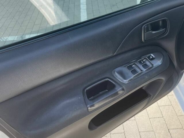 Білий Міцубісі Lancer, об'ємом двигуна 1.6 л та пробігом 279 тис. км за 3900 $, фото 6 на Automoto.ua