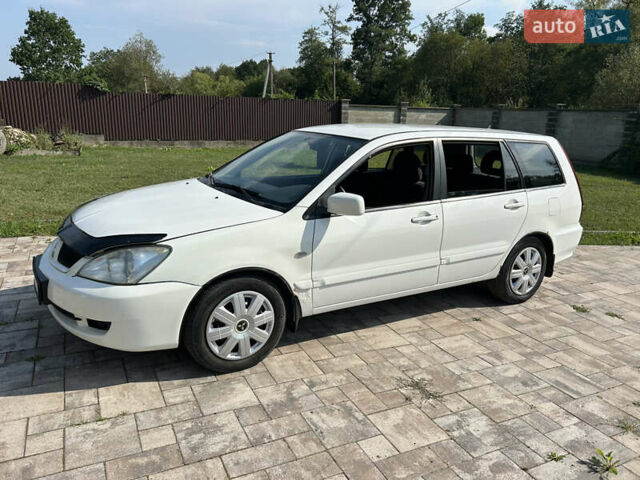 Білий Міцубісі Lancer, об'ємом двигуна 1.6 л та пробігом 147 тис. км за 3100 $, фото 1 на Automoto.ua