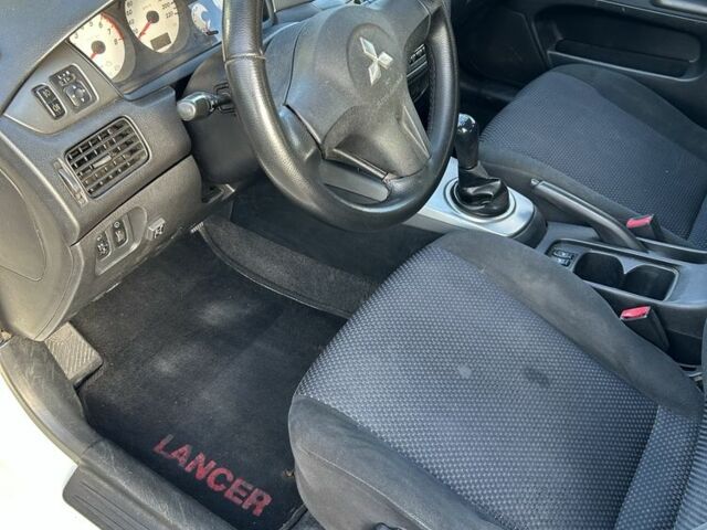 Мицубиси Лансер 2008 в Ивано-Франковске на Automoto.ua Белый Мицубиси Лансер, объемом двигателя 1.6 л и пробегом 147 тыс. км за 3800 $, фото 9 на Automoto.ua