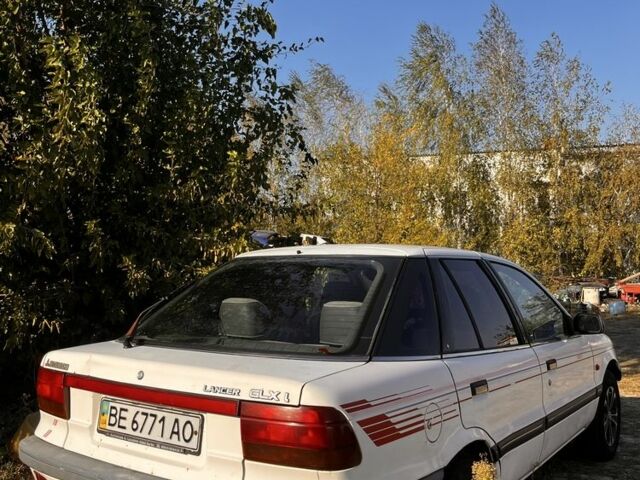 Білий Міцубісі Lancer, об'ємом двигуна 1.8 л та пробігом 350 тис. км за 2100 $, фото 3 на Automoto.ua