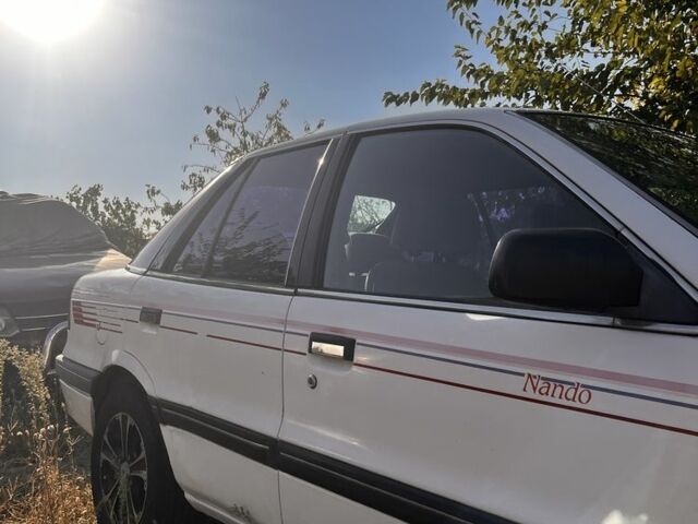 Білий Міцубісі Lancer, об'ємом двигуна 1.8 л та пробігом 350 тис. км за 2100 $, фото 6 на Automoto.ua