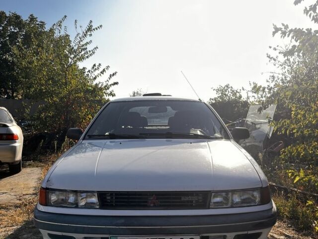 Білий Міцубісі Lancer, об'ємом двигуна 1.8 л та пробігом 350 тис. км за 2100 $, фото 2 на Automoto.ua