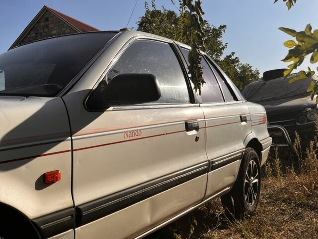 Білий Міцубісі Lancer, об'ємом двигуна 1.8 л та пробігом 350 тис. км за 2100 $, фото 5 на Automoto.ua