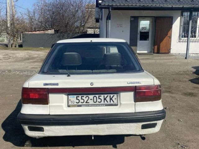 Белый Мицубиси Лансер, объемом двигателя 1.5 л и пробегом 250 тыс. км за 1100 $, фото 3 на Automoto.ua