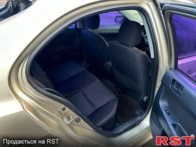 Бежевий Міцубісі Lancer, об'ємом двигуна 1.8 л та пробігом 154 тис. км за 6300 $, фото 9 на Automoto.ua