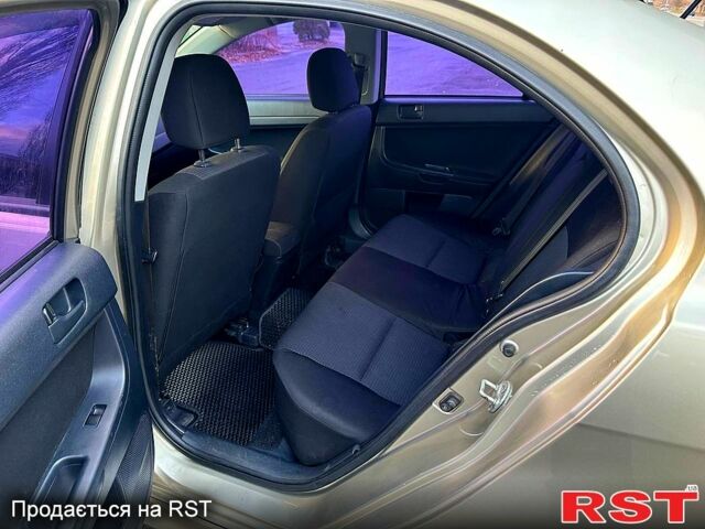 Бежевий Міцубісі Lancer, об'ємом двигуна 1.8 л та пробігом 154 тис. км за 6300 $, фото 10 на Automoto.ua
